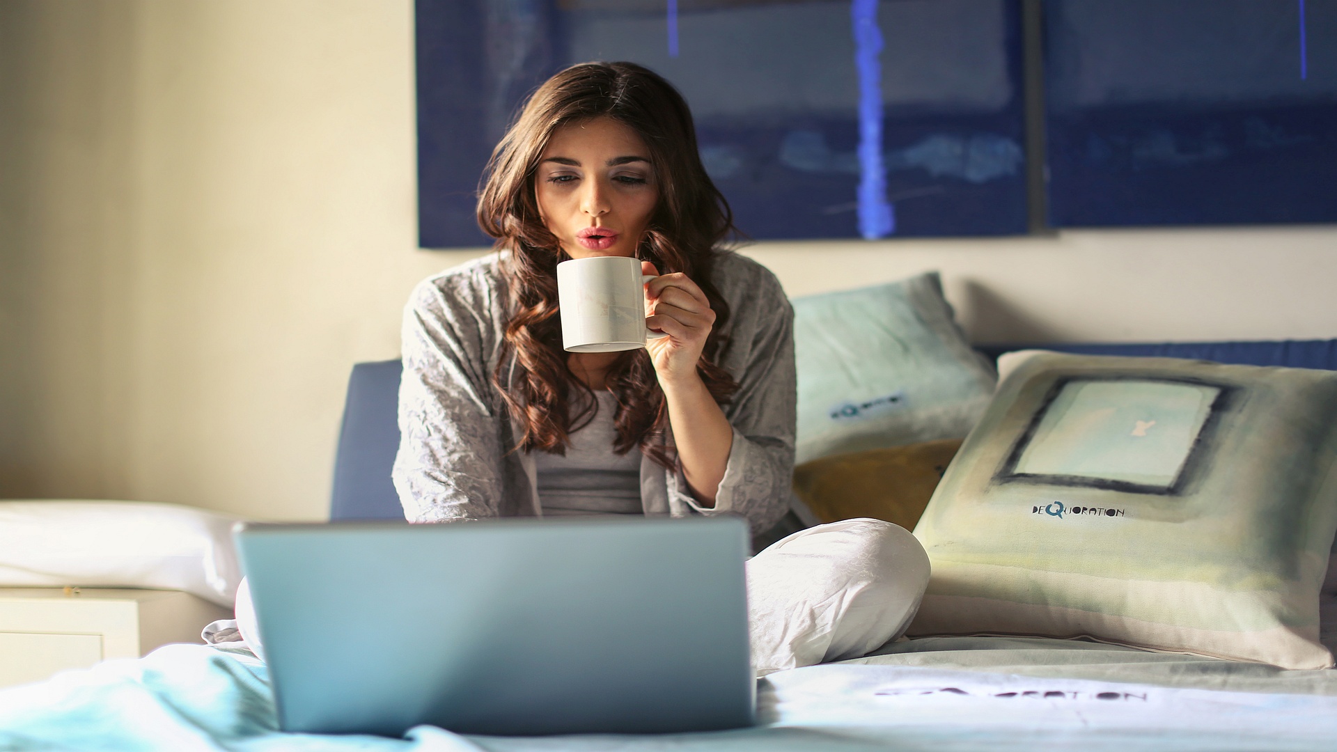 Woman taking an online English lesson on a laptop